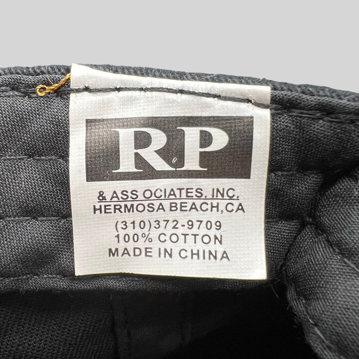 Raree Finds black cotton hat interior care label with brand logo and manufacturing details