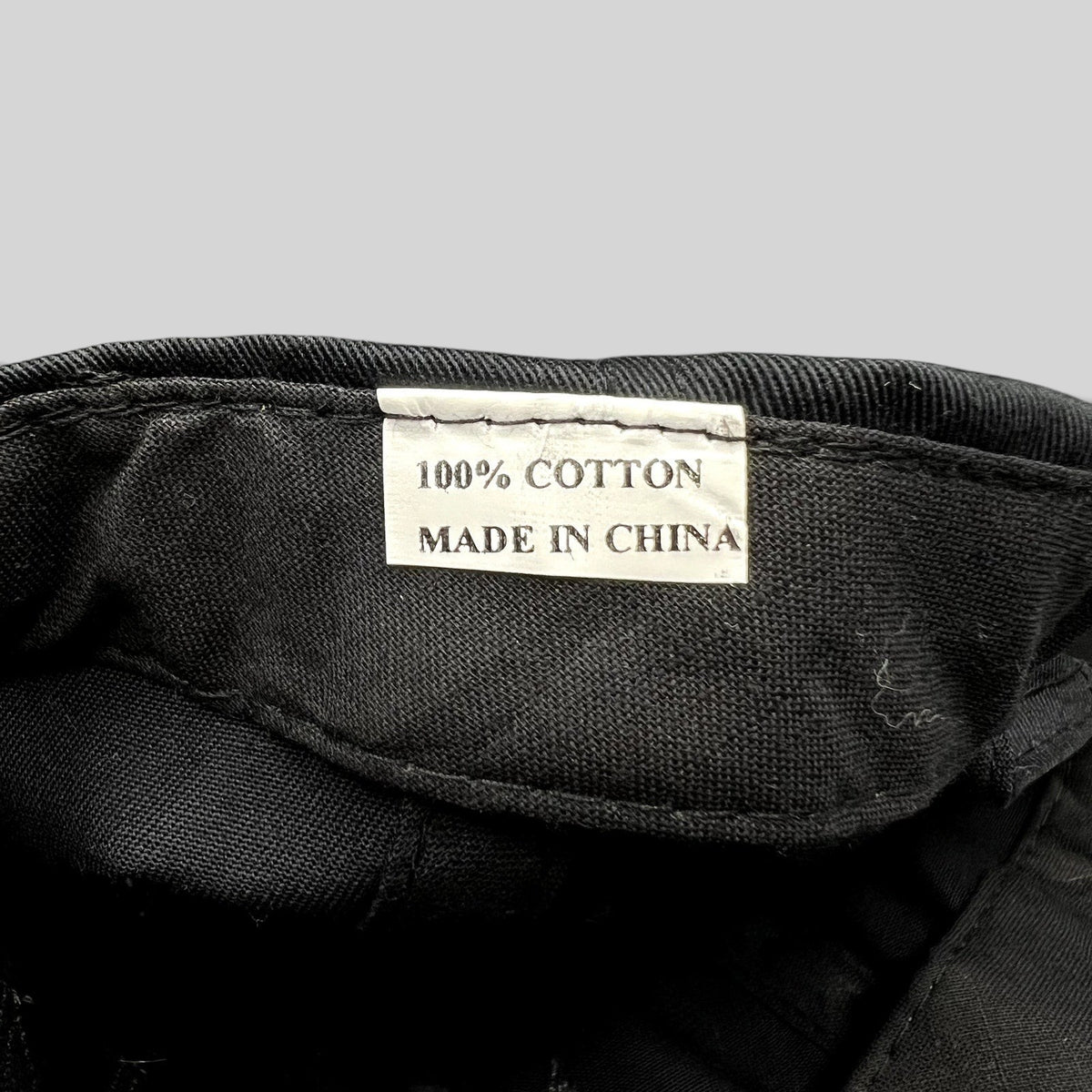 Raree Finds Adam Lambert snapback hat interior label showing 100 percent cotton material and made in China tag