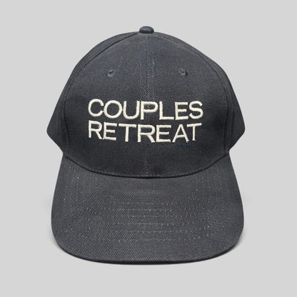 Raree Finds navy cotton strapback hat with white Couples Retreat film embroidery and adjustable brass clasp closure.