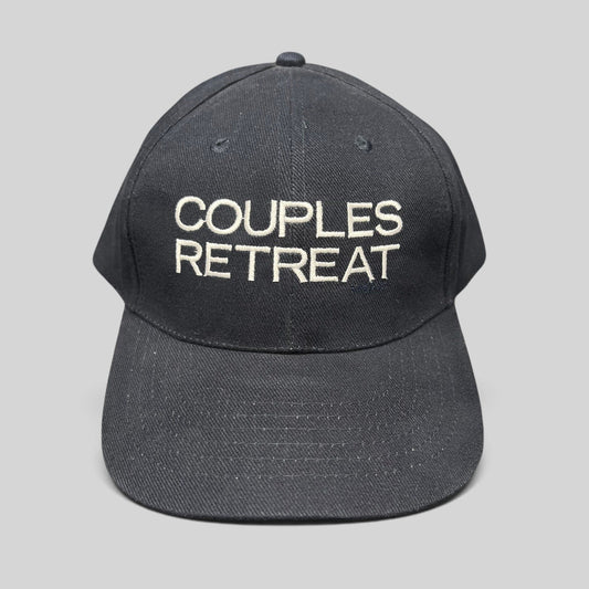 Raree Finds navy cotton strapback hat with white Couples Retreat film embroidery and adjustable brass clasp closure.