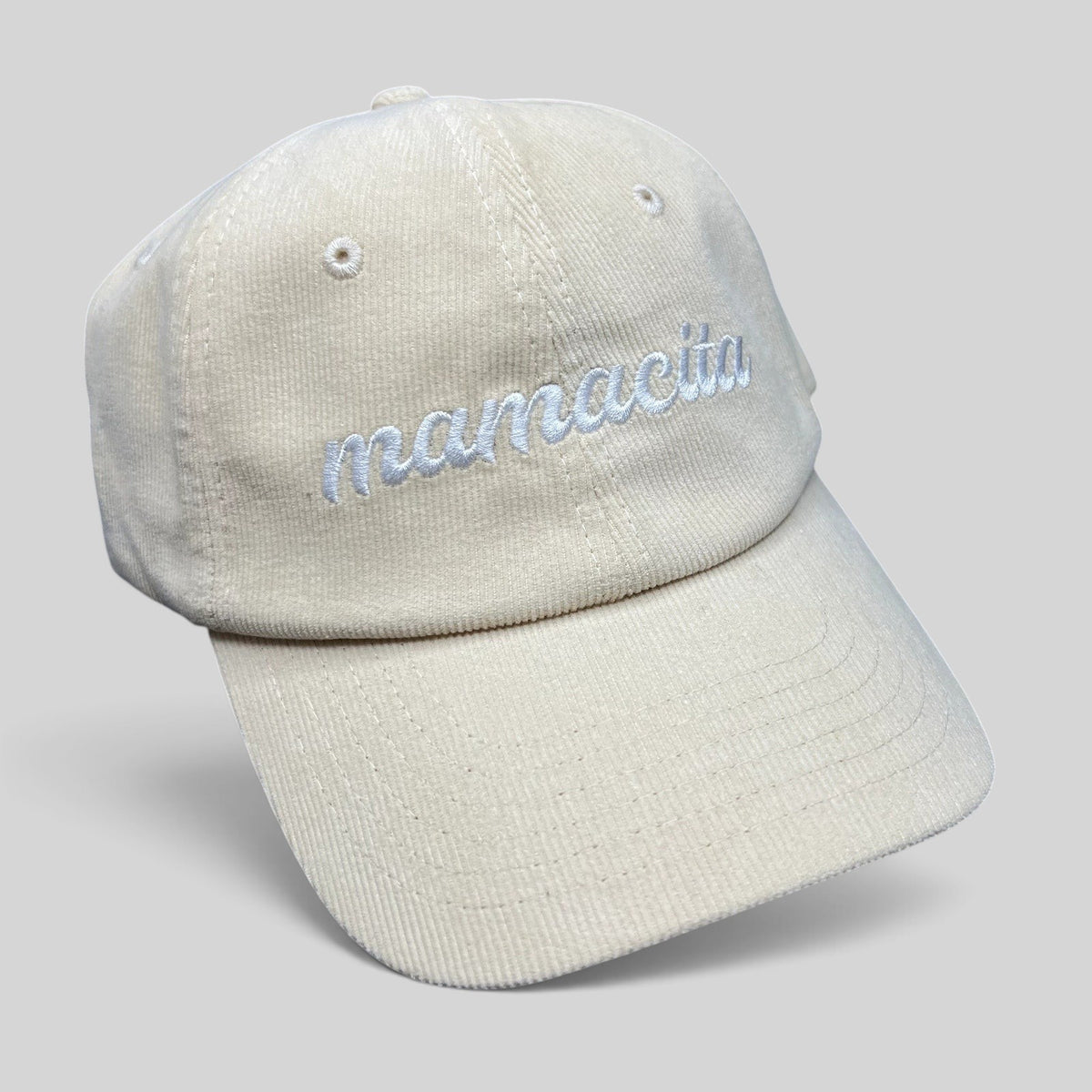 Raree Finds cream corduroy strapback hat with white Mamacita embroidery in a minimalist low-profile streetwear style.