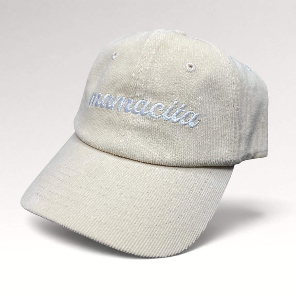 Raree Finds cream corduroy strapback hat with Mamacita embroidered in white script on the front