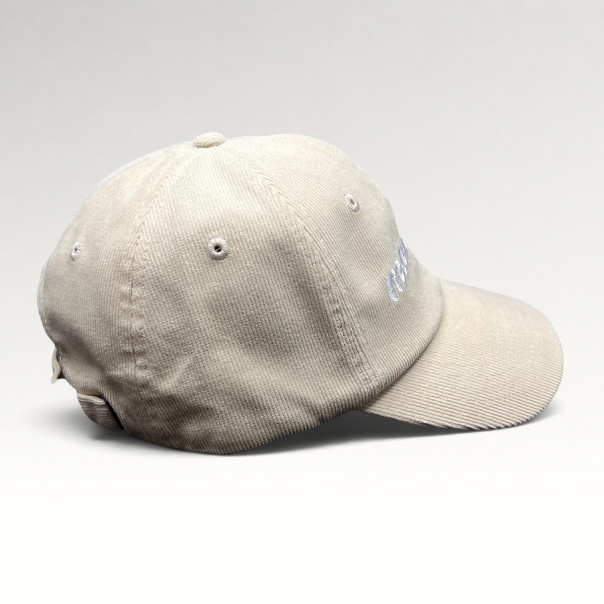 Raree Finds cream corduroy strapback hat with Mamacita embroidery in a minimalist low-profile streetwear style.