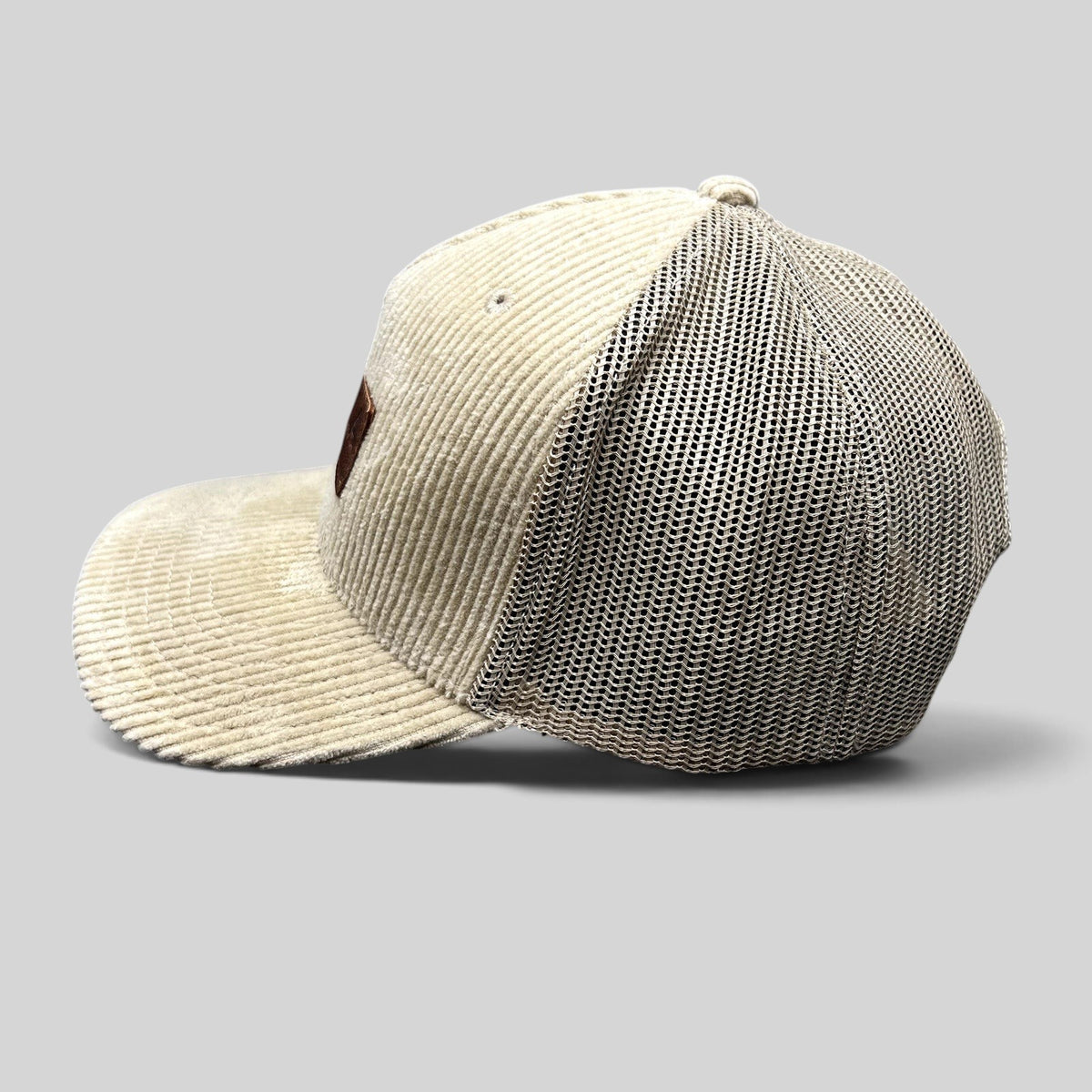 Raree Finds Mabula Game Lodge cream corduroy trucker hat with breathable mesh back and leather patch side view