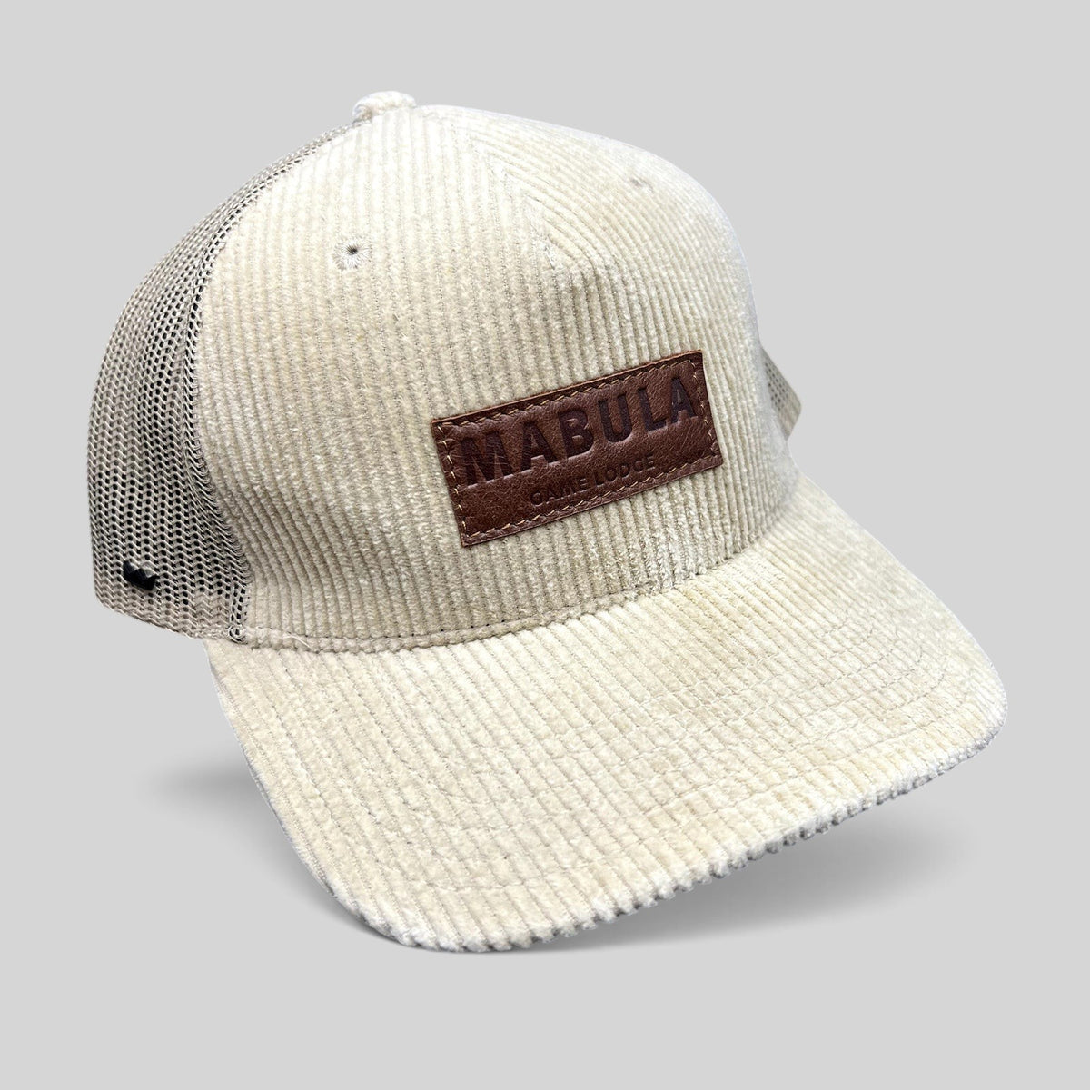 Raree Finds cream corduroy trucker hat with breathable mesh back and embossed leather Mabula Game Lodge patch