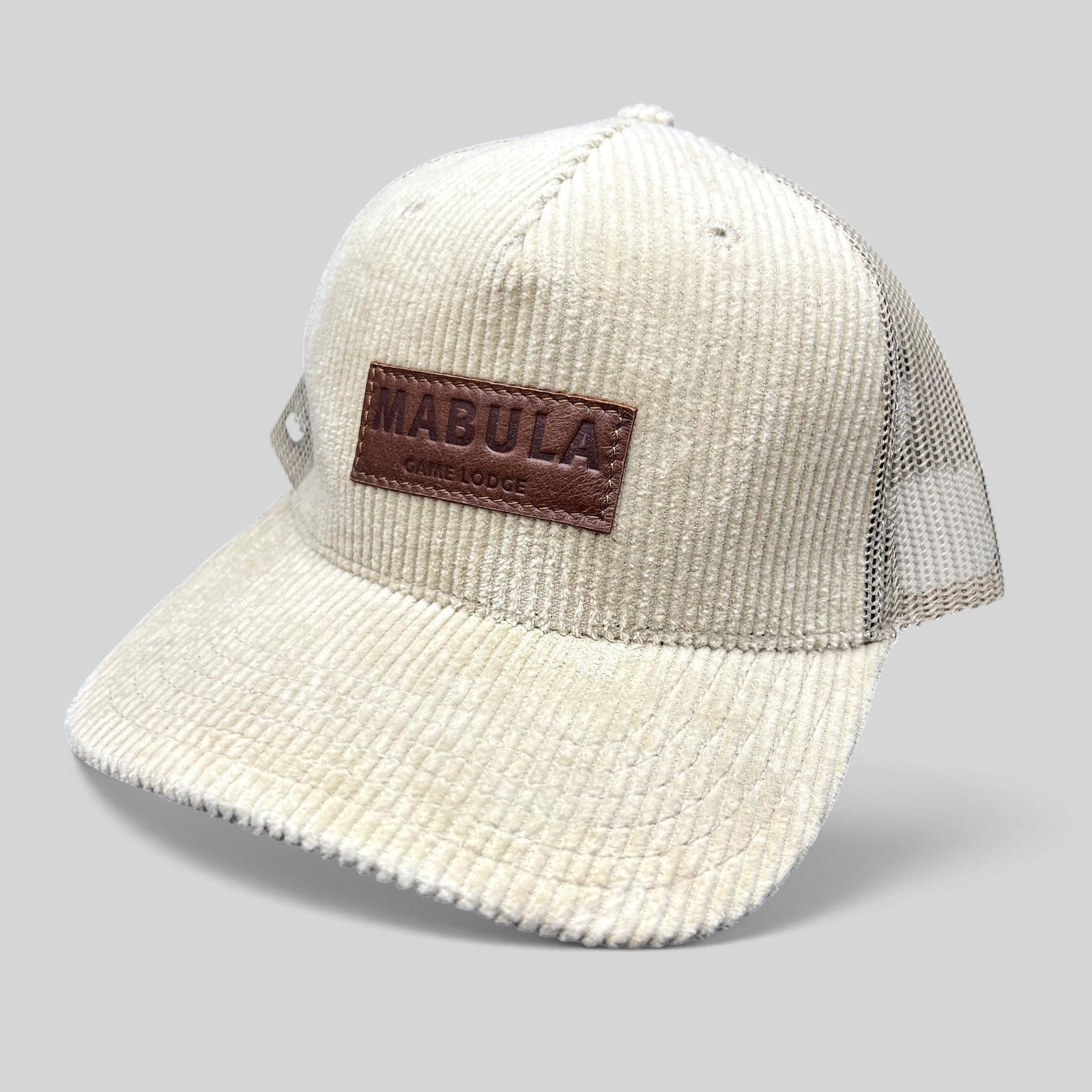 Raree Finds cream corduroy trucker hat with breathable mesh back and embossed leather Mabula Game Lodge patch