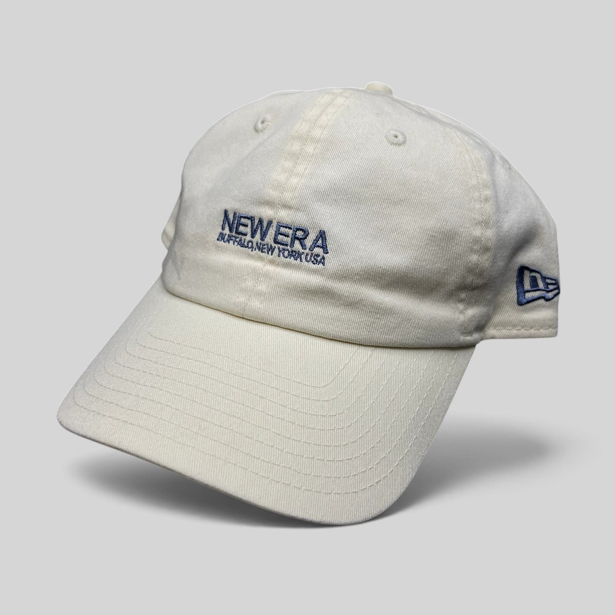 Raree Finds cream 100% cotton New Era strapback hat with embroidered Buffalo New York USA logo and curved brim