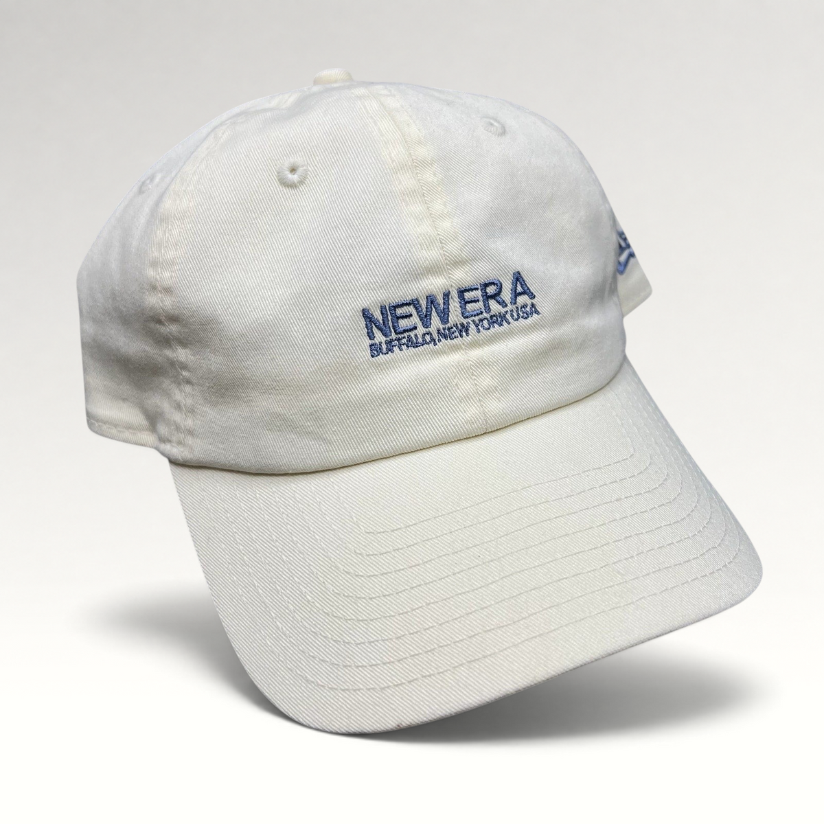 Raree Finds cream New Era cotton strapback hat with embroidered Buffalo New York USA logo and relaxed curved brim