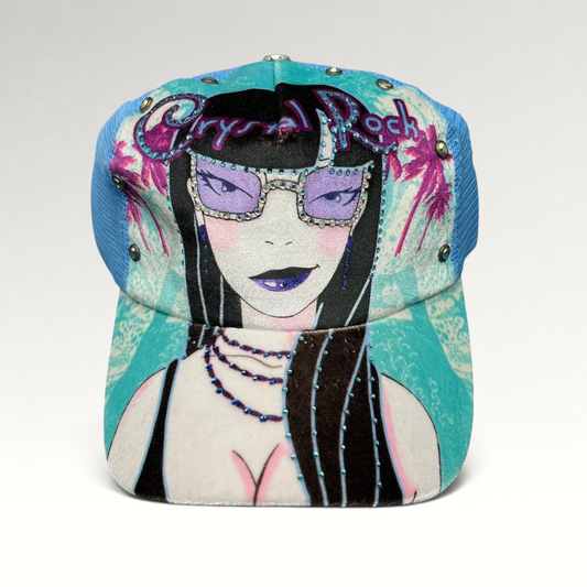 Raree Finds Crystal Rock by Christian Audigier teal trucker hat with rhinestone graphic and metallic stud accents.
