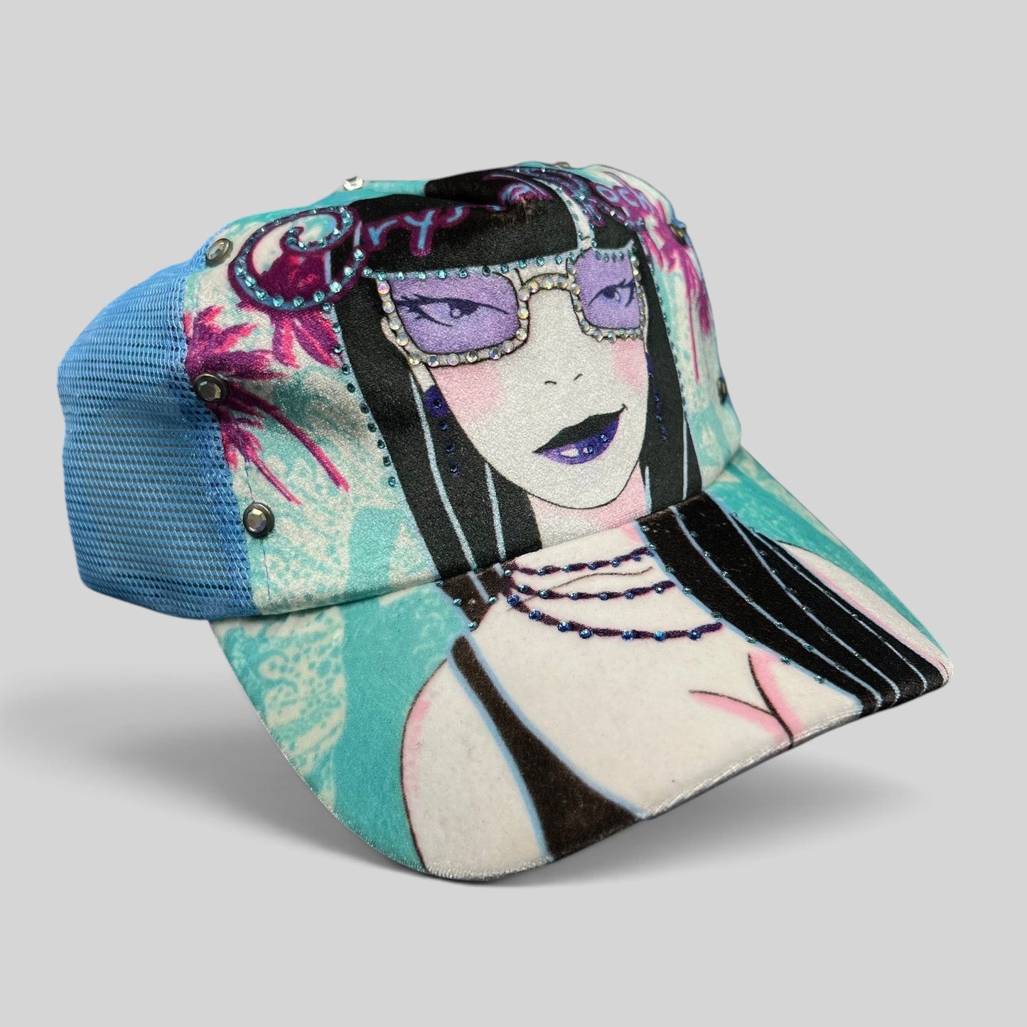 Raree Finds Crystal Rock by Christian Audigier teal trucker hat with Y2K female graphic, rhinestones, and studs.
