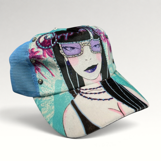Raree Finds Crystal Rock by Christian Audigier teal trucker hat with Y2K female graphic, rhinestones, and studs.