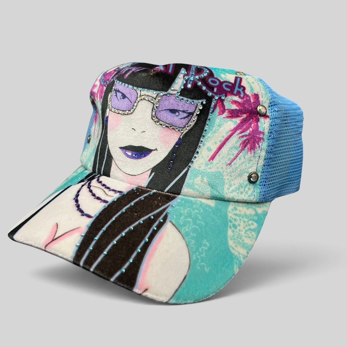 Raree Finds Crystal Rock by Christian Audigier teal trucker hat with Y2K female graphic, rhinestones, and studs.
