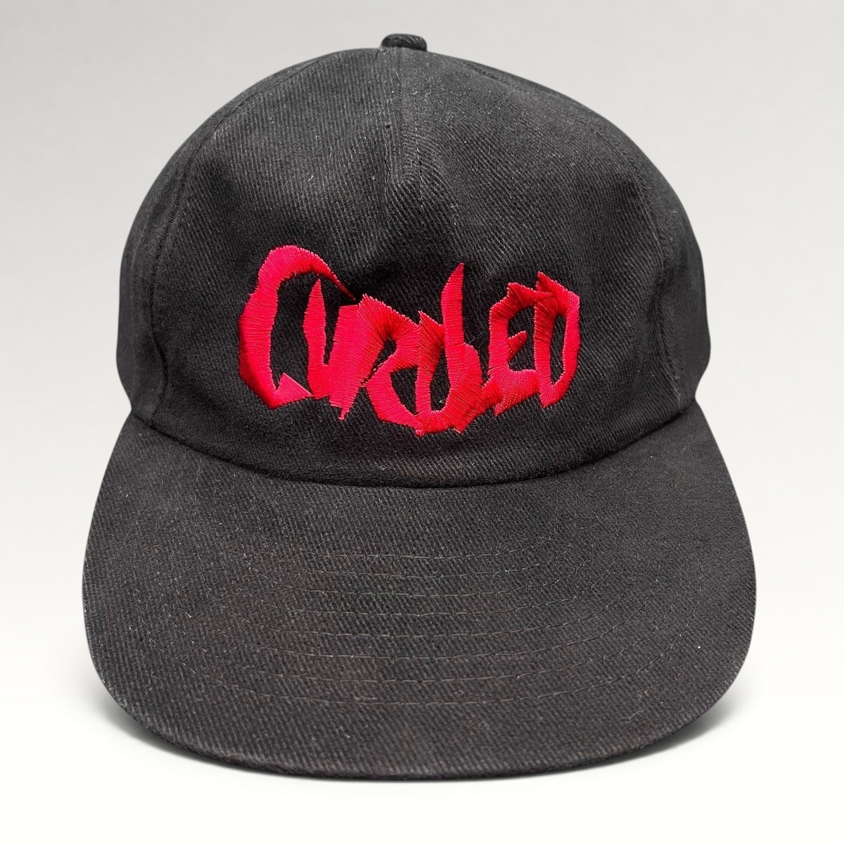Raree Finds black cotton snapback hat with red embroidered Curdled metal band logo on the front panel
