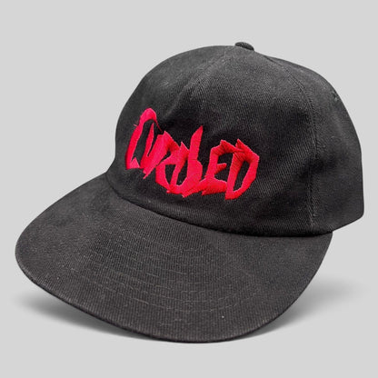 Raree Finds black cotton snapback hat with red embroidered Curdled metal band logo on the front panel.