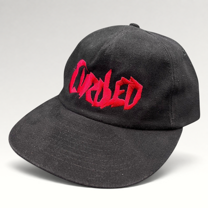 Raree Finds black cotton snapback hat with red embroidered Curdled metal band logo on the front panel.