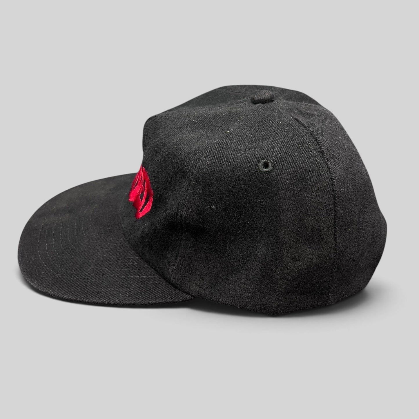 Raree Finds black cotton snapback hat with red embroidered Curdled metal band logo on the front panel.