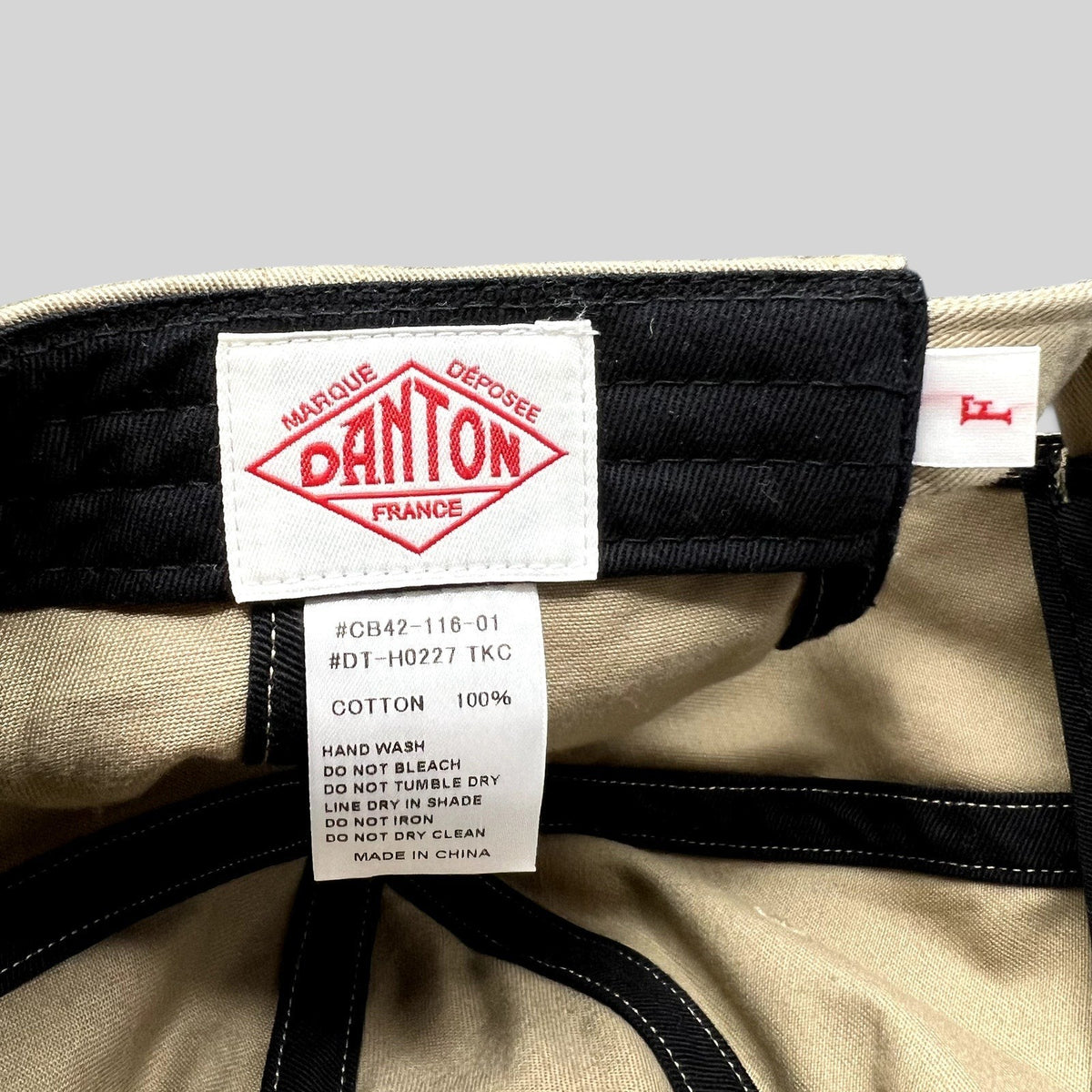Raree Finds Danton khaki cotton twill cap interior showing brand logo label and care instructions