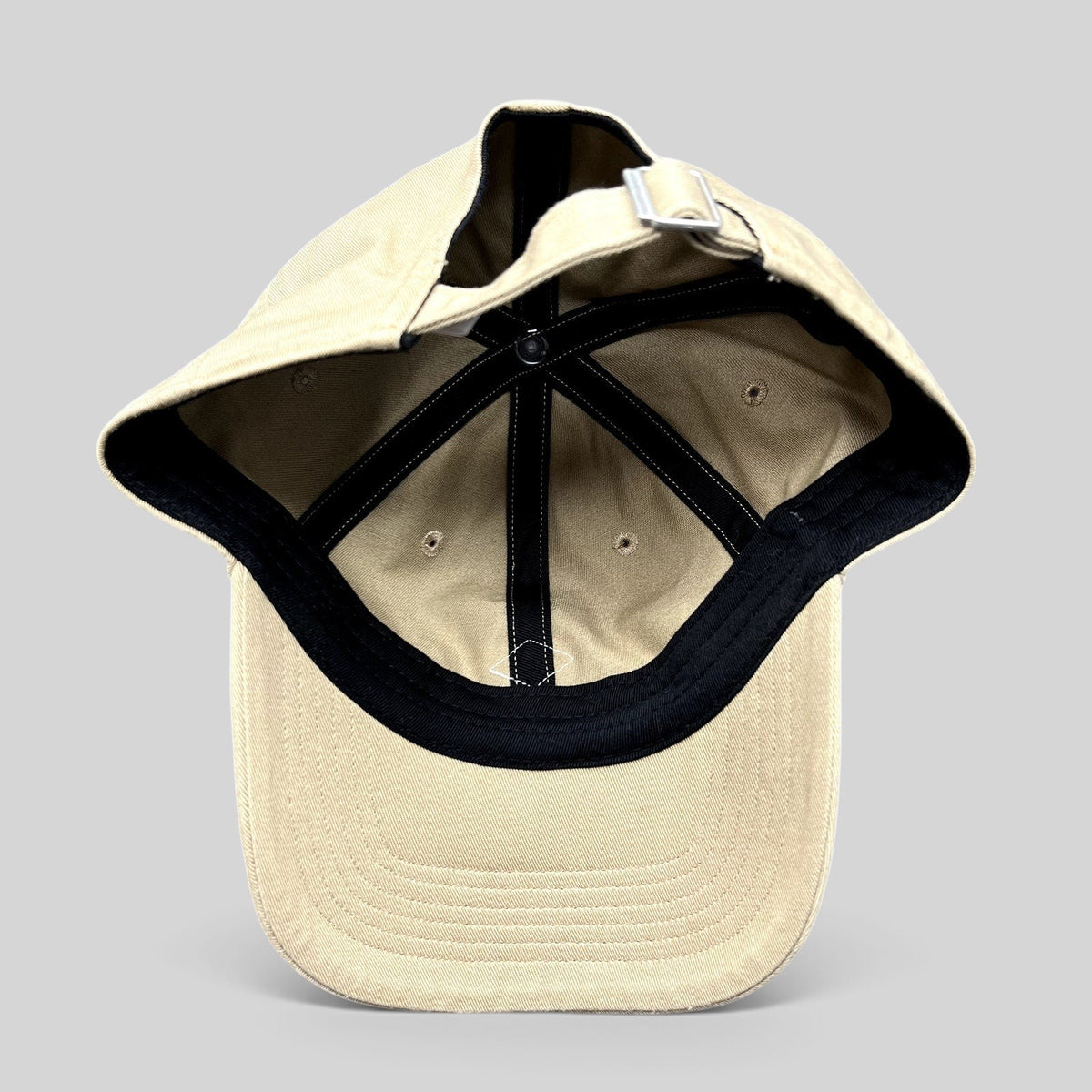 Raree Finds Danton khaki cotton twill strapback hat, interior view showing six-panel construction and metal buckle.