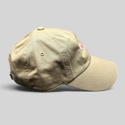 Raree Finds Danton khaki cotton twill strapback hat with a minimalist red diamond logo on the six-panel cap