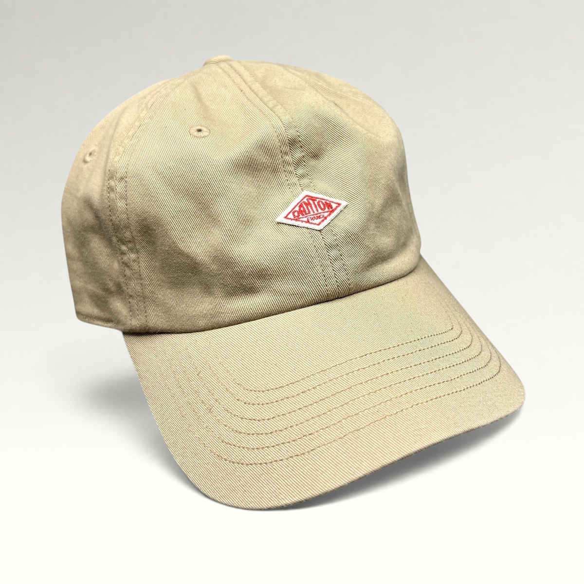 Raree Finds Danton khaki cotton twill strapback hat with red diamond logo embroidery on a six-panel cap