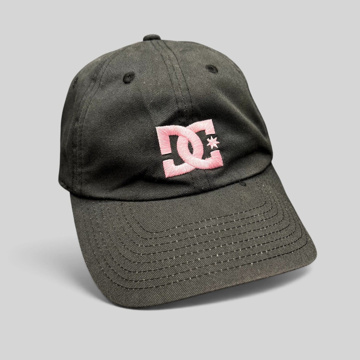 Raree Finds DC Shoes black cotton strapback hat with an embroidered pink logo in a low-profile skate style