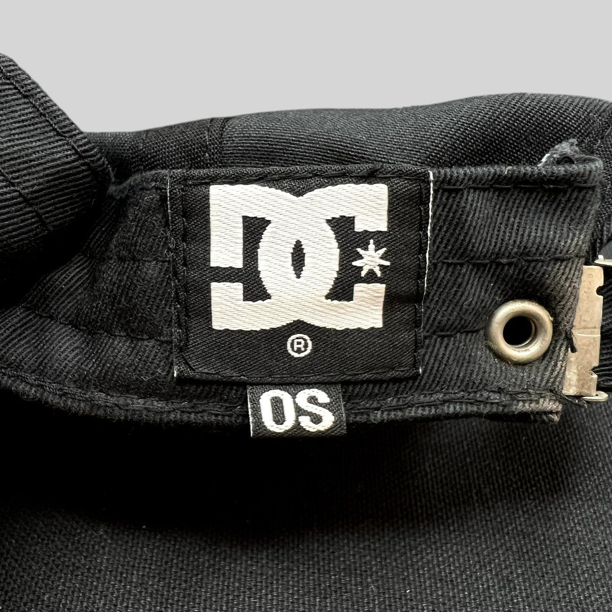 Raree Finds DC Shoes black cotton strapback hat featuring the iconic white DC logo tag and OS size label