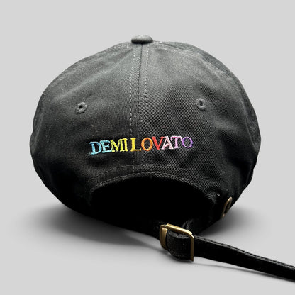 Raree Finds black cotton dad hat with colorful rainbow DEMI LOVATO embroidery on the back and metal buckle strap.