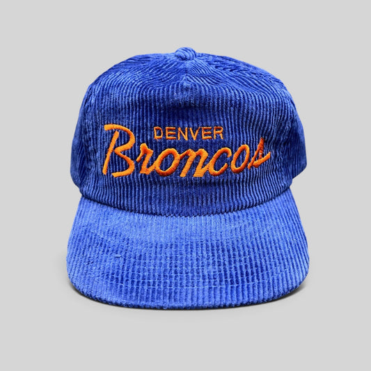 Raree Finds vintage Denver Broncos blue corduroy cap with orange embroidered script and adjustable zipback closure