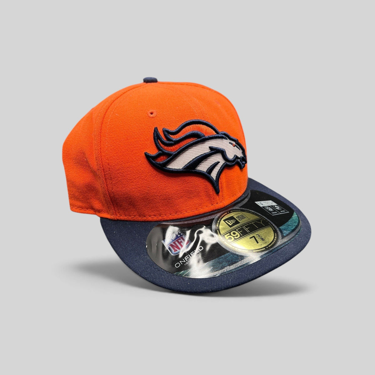 Raree Finds Denver Broncos New Era fitted hat with orange crown, navy brim, and embroidered team logo