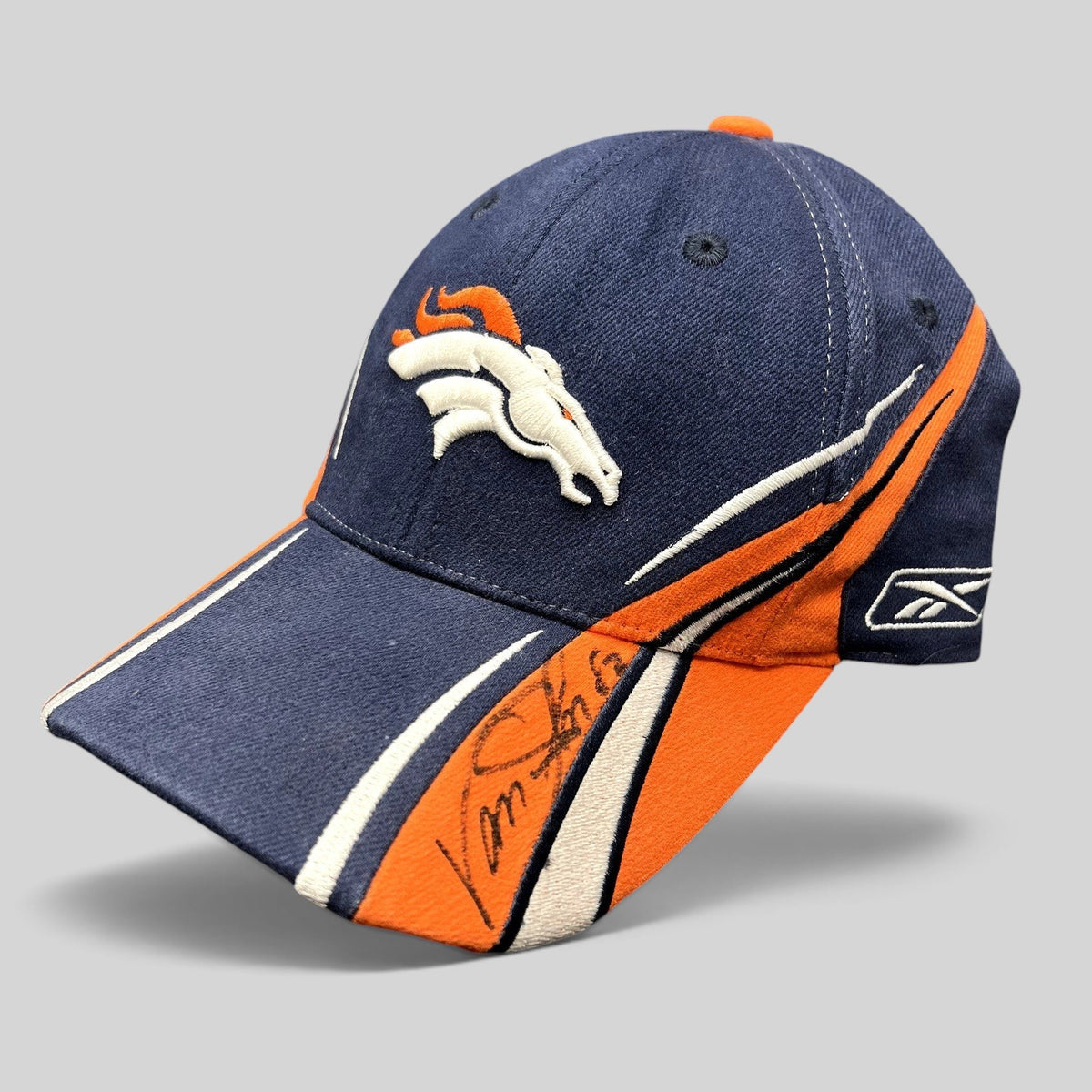 Raree Finds vintage Reebok Denver Broncos sideline hat in navy and orange with Vance Johnson autograph on the brim.
