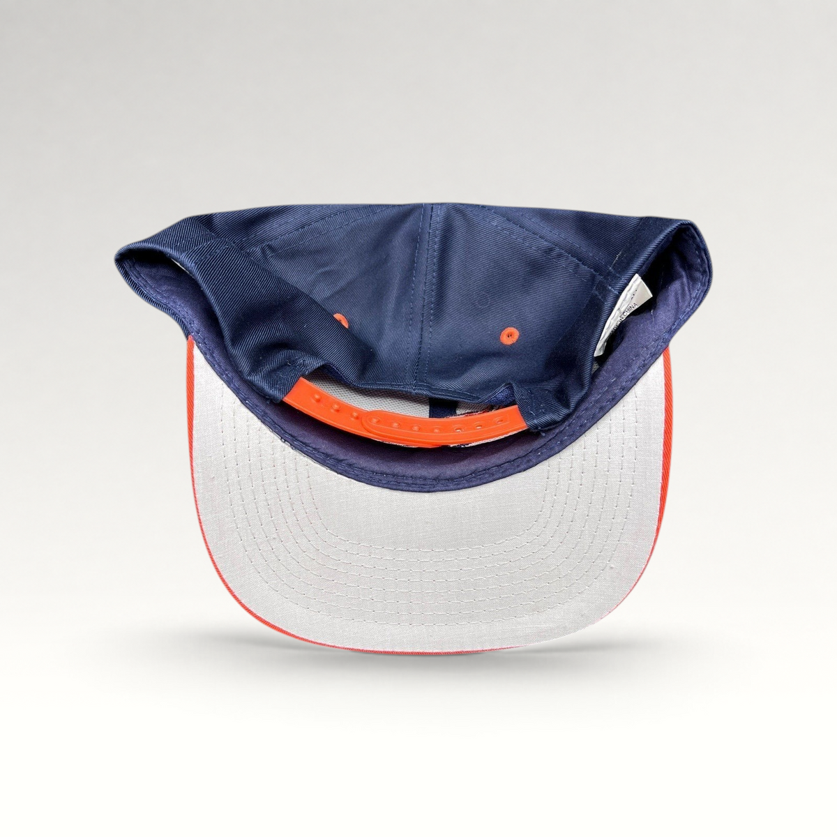 Raree Finds vintage Denver Broncos Logo Athletic snapback hat showing the interior gray undervisor and orange strap.