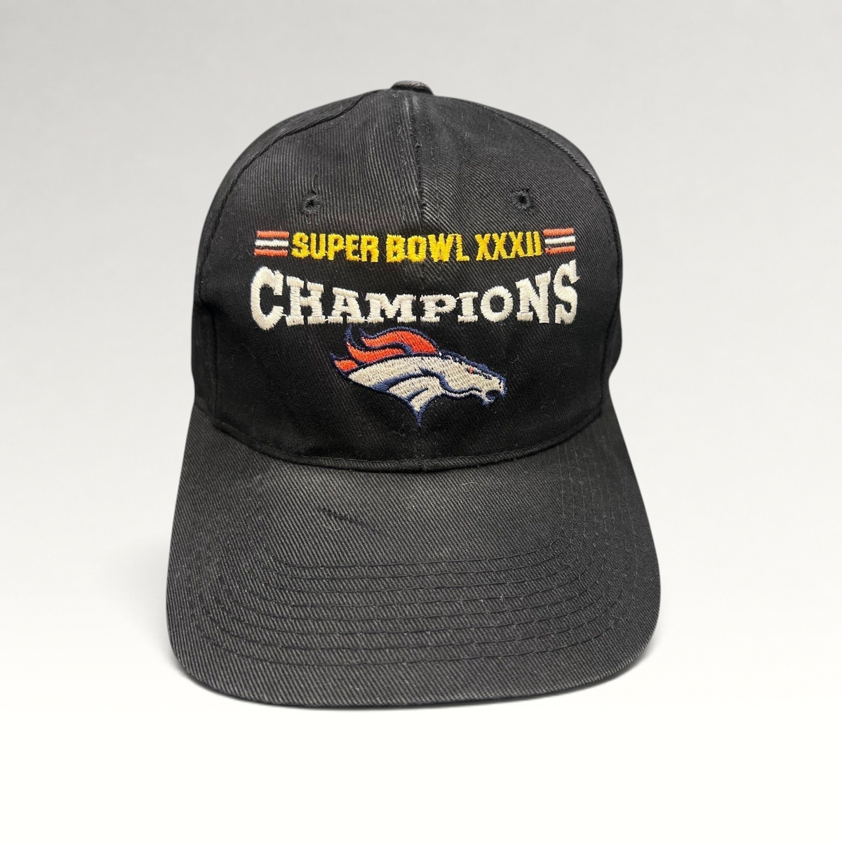 Raree Finds vintage 1998 Denver Broncos Super Bowl XXXII Champions black cotton strapback hat with team embroidery.