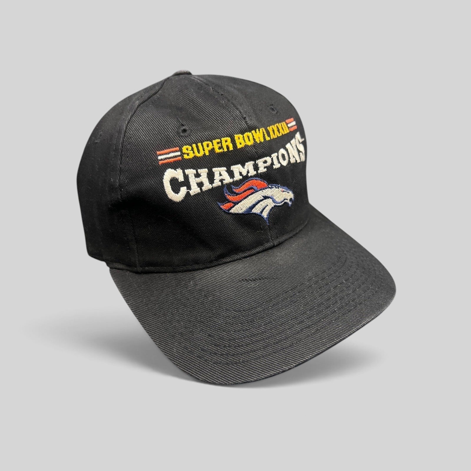 Raree Finds vintage 1998 Denver Broncos Super Bowl XXXII Champions black cotton strapback hat with embroidery.