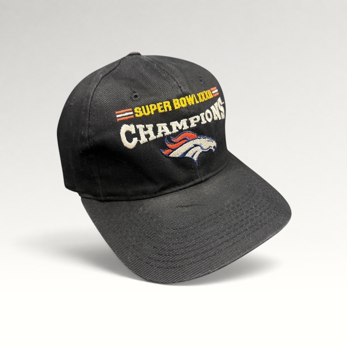 Raree Finds vintage 1998 Denver Broncos Super Bowl XXXII Champions black cotton strapback hat with embroidery.