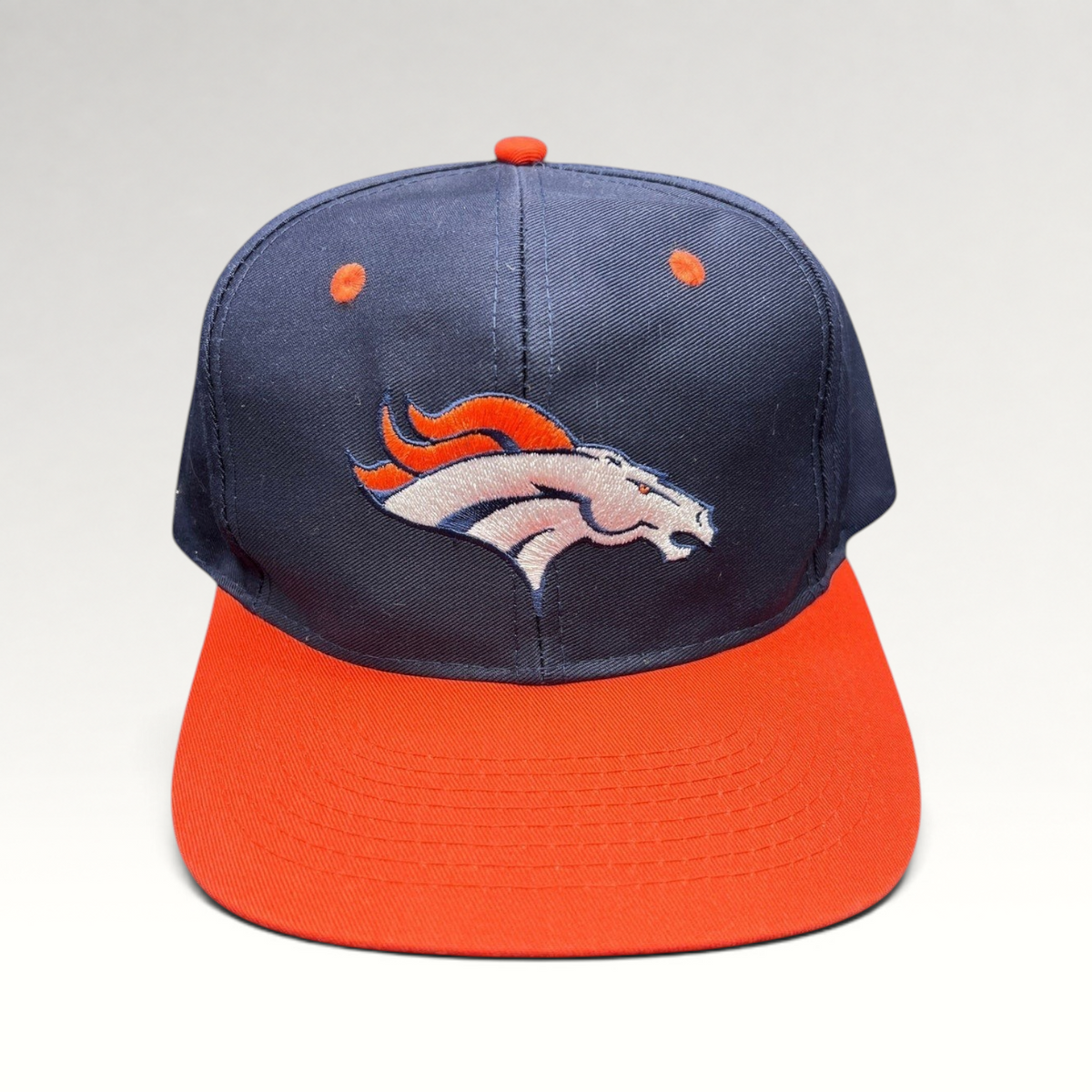 Raree Finds vintage Denver Broncos Logo Athletic snapback hat in navy blue and orange with embroidered team logo.