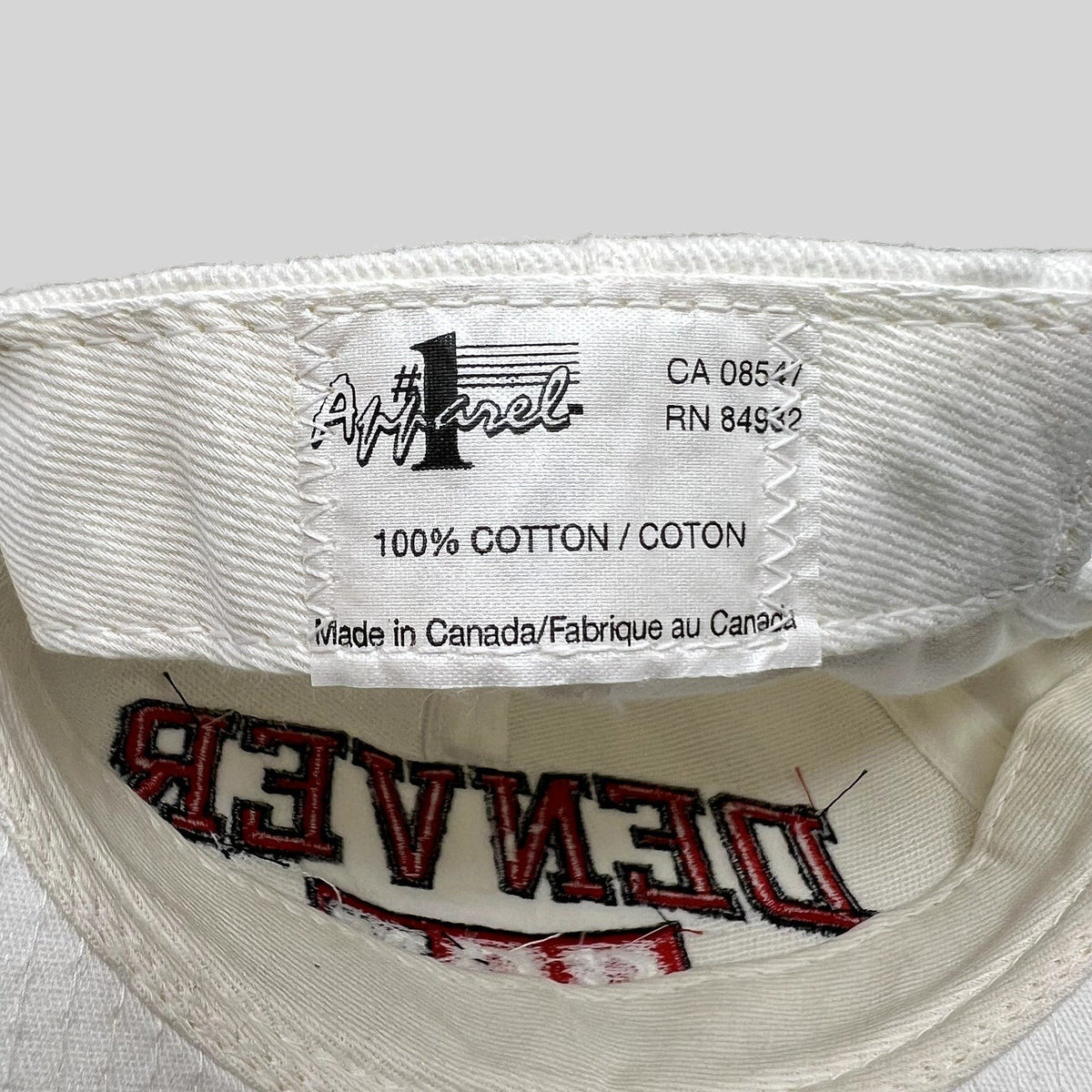 Raree Finds vintage Denver Hockey snapback interior label showing 100% cotton and Made in Canada manufacturing details