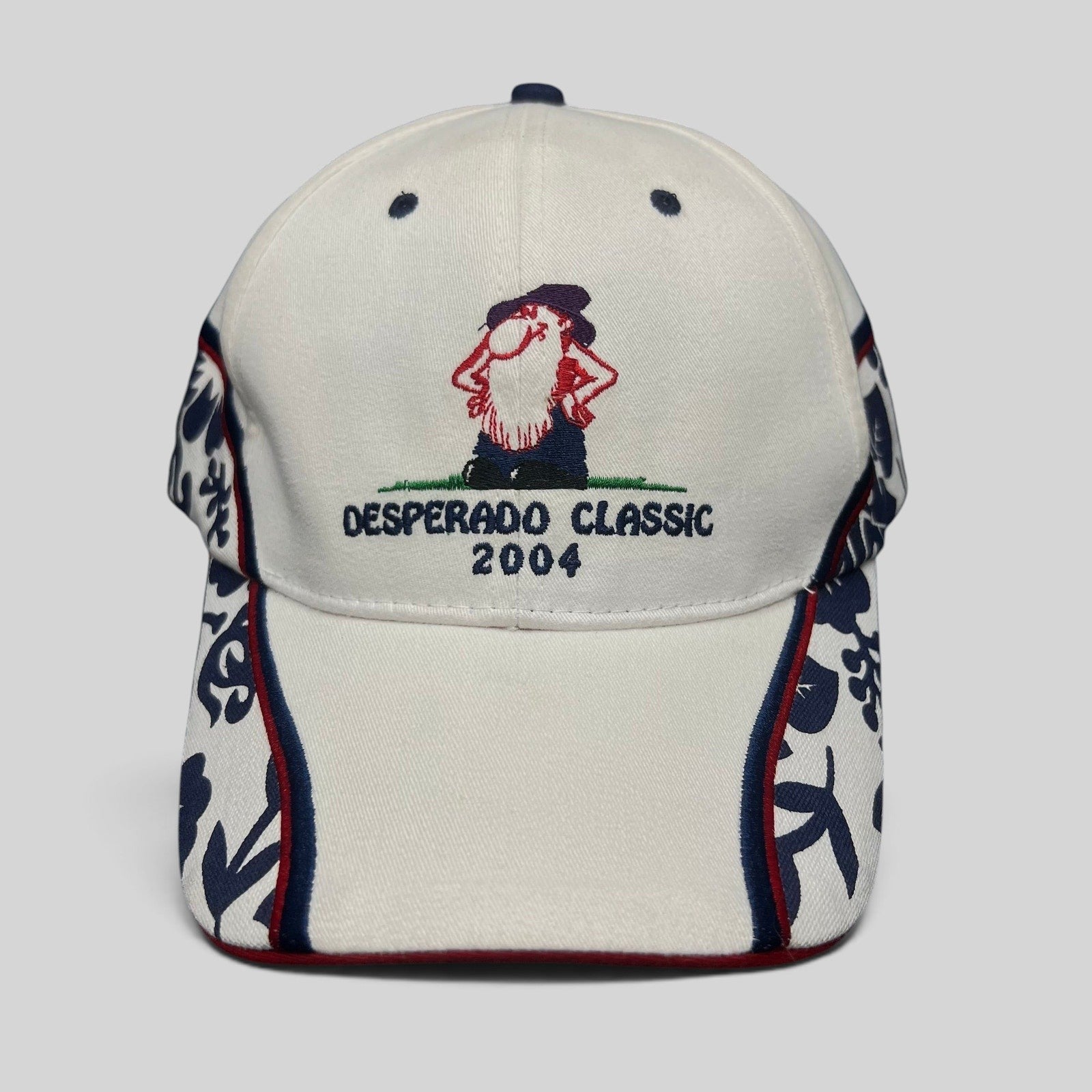 Raree Finds 2004 Desperado Golf Classic white cotton strapback hat with western embroidered logo and patterned panels