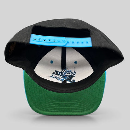 Raree Finds vintage Detroit Jazz Festival Yupoong snapback hat with black crown, teal brim, and blue plastic strap.