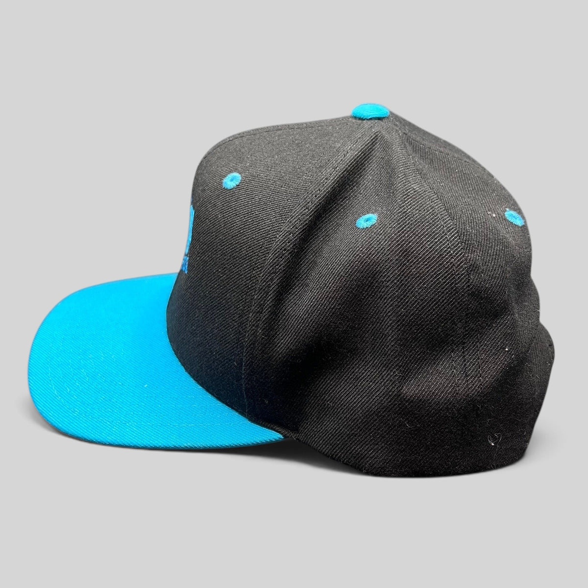 Raree Finds vintage Detroit Jazz Festival snapback hat with a black crown, teal brim, and structured wool-blend fit.
