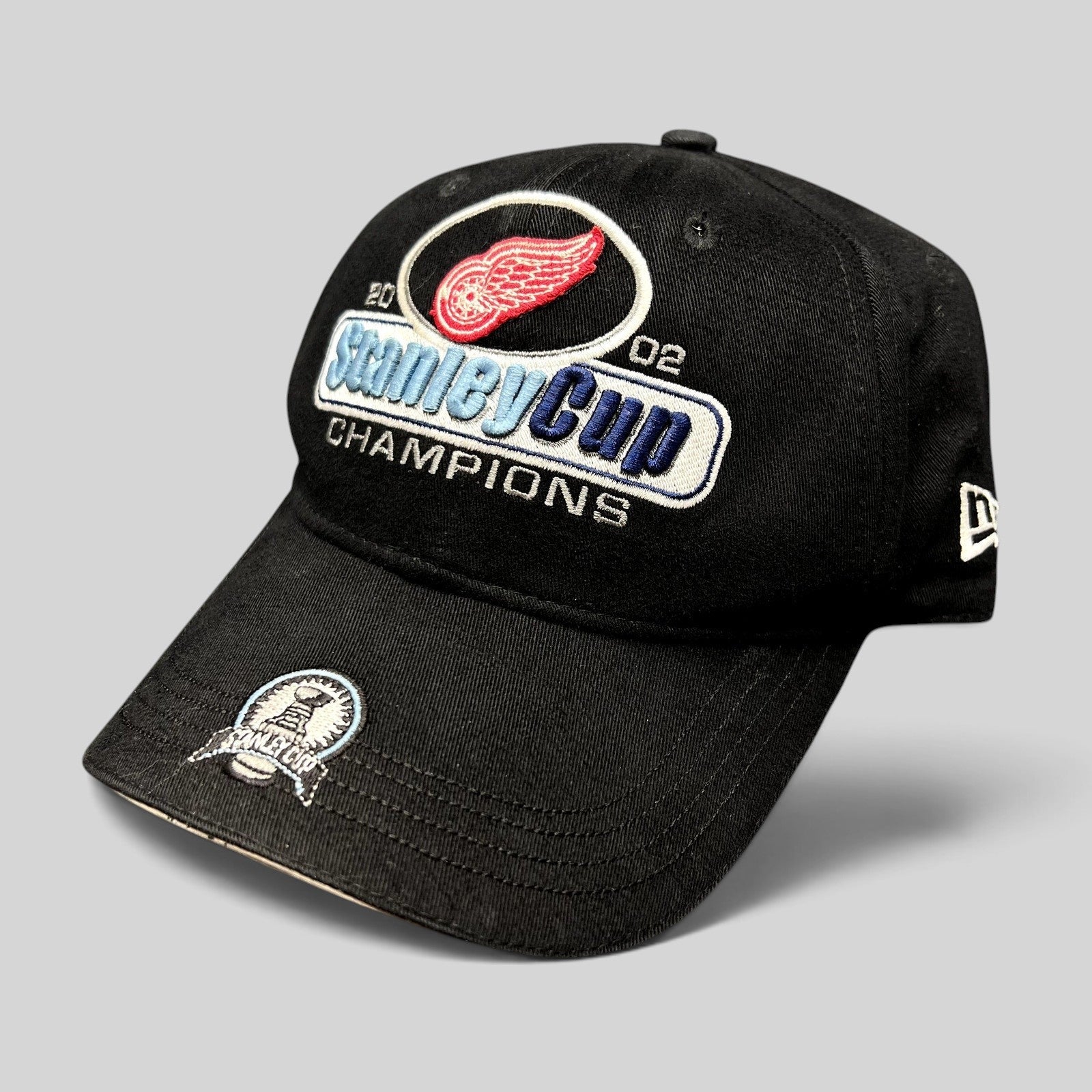 Raree Finds vintage 2002 Detroit Red Wings Stanley Cup Champions black New Era strapback hat with embroidered logos