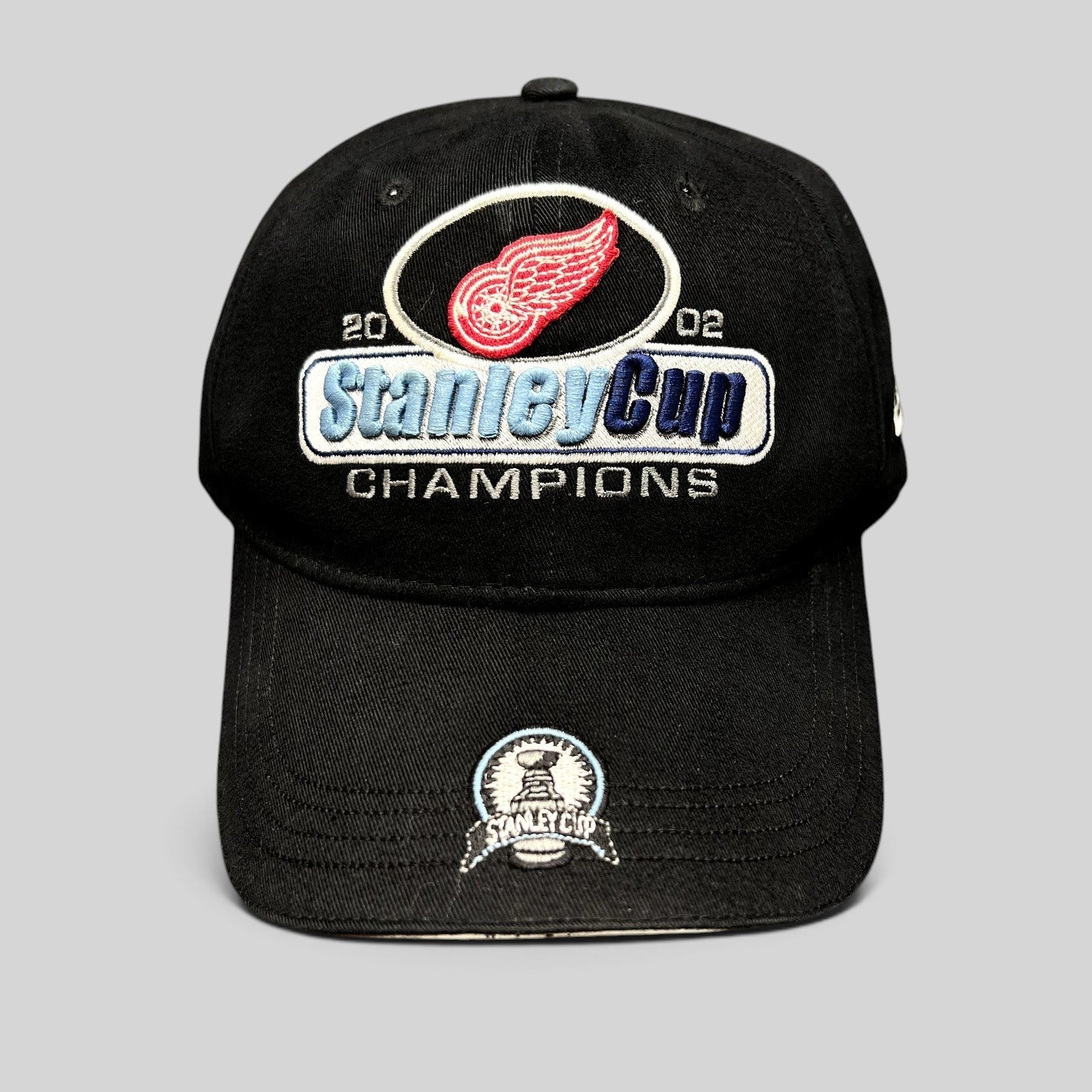 Raree Finds vintage 2002 Detroit Red Wings Stanley Cup Champions black strapback hat with embroidered brim patch
