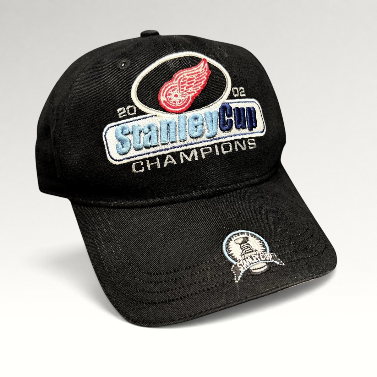 Raree Finds vintage 2002 Detroit Red Wings Stanley Cup Champions black strapback hat with embroidered brim patch