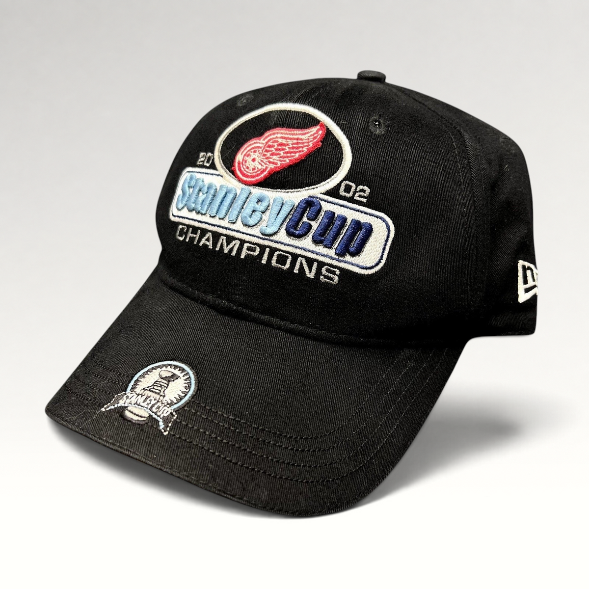 Raree Finds vintage 2002 Detroit Red Wings Stanley Cup Champions New Era black strapback hat with brim embroidery