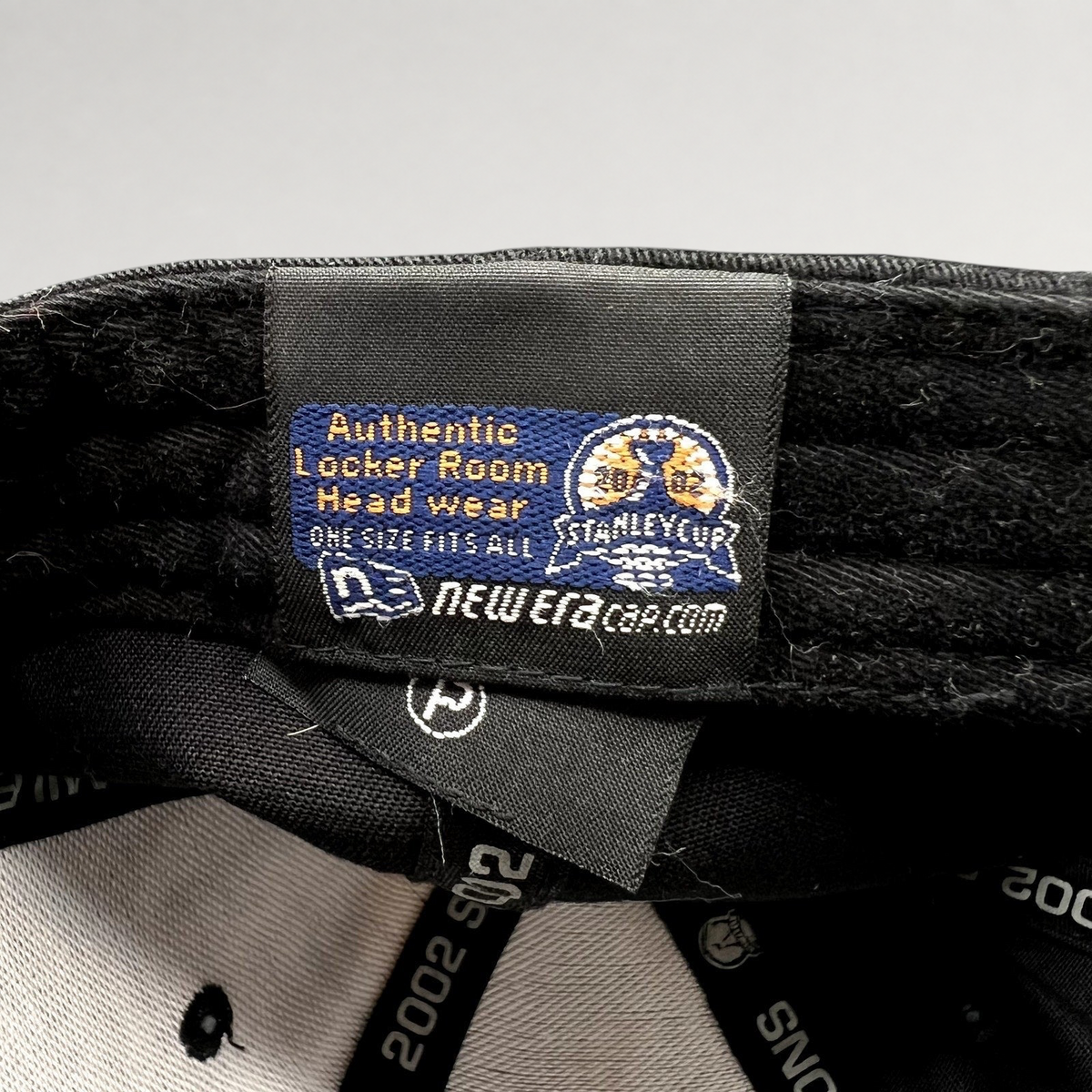 Raree Finds vintage 2002 Detroit Red Wings New Era locker room hat interior label with Stanley Cup branding