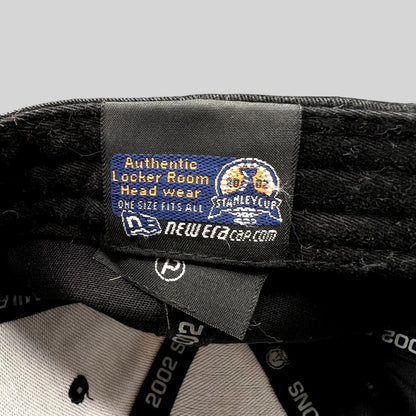 Raree Finds vintage 2002 Detroit Red Wings New Era locker room hat interior tag with Stanley Cup branding