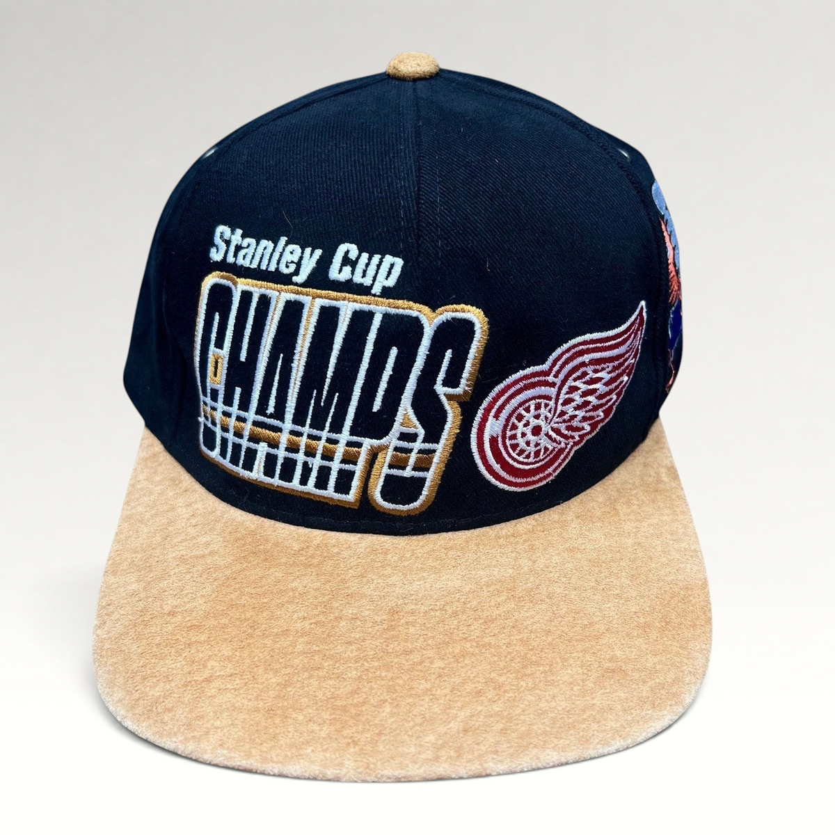 Raree Finds vintage Detroit Red Wings 1997 Stanley Cup Champs Starter snapback hat with black crown and tan suede brim.