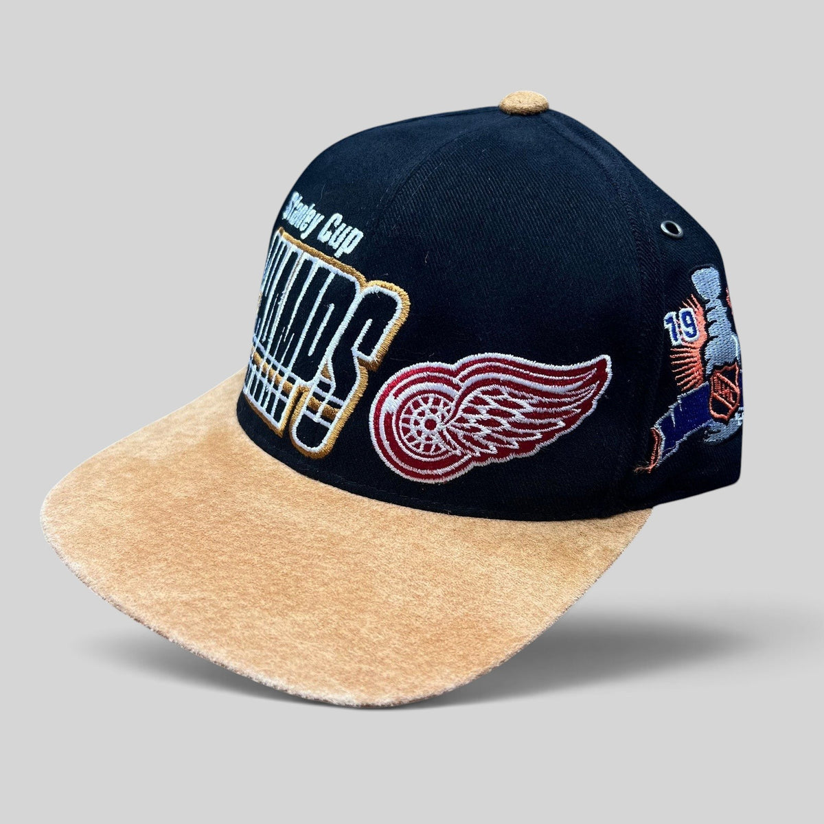 Raree Finds vintage Detroit Red Wings 1997 Stanley Cup Champs Starter snapback hat with black crown and tan suede brim.