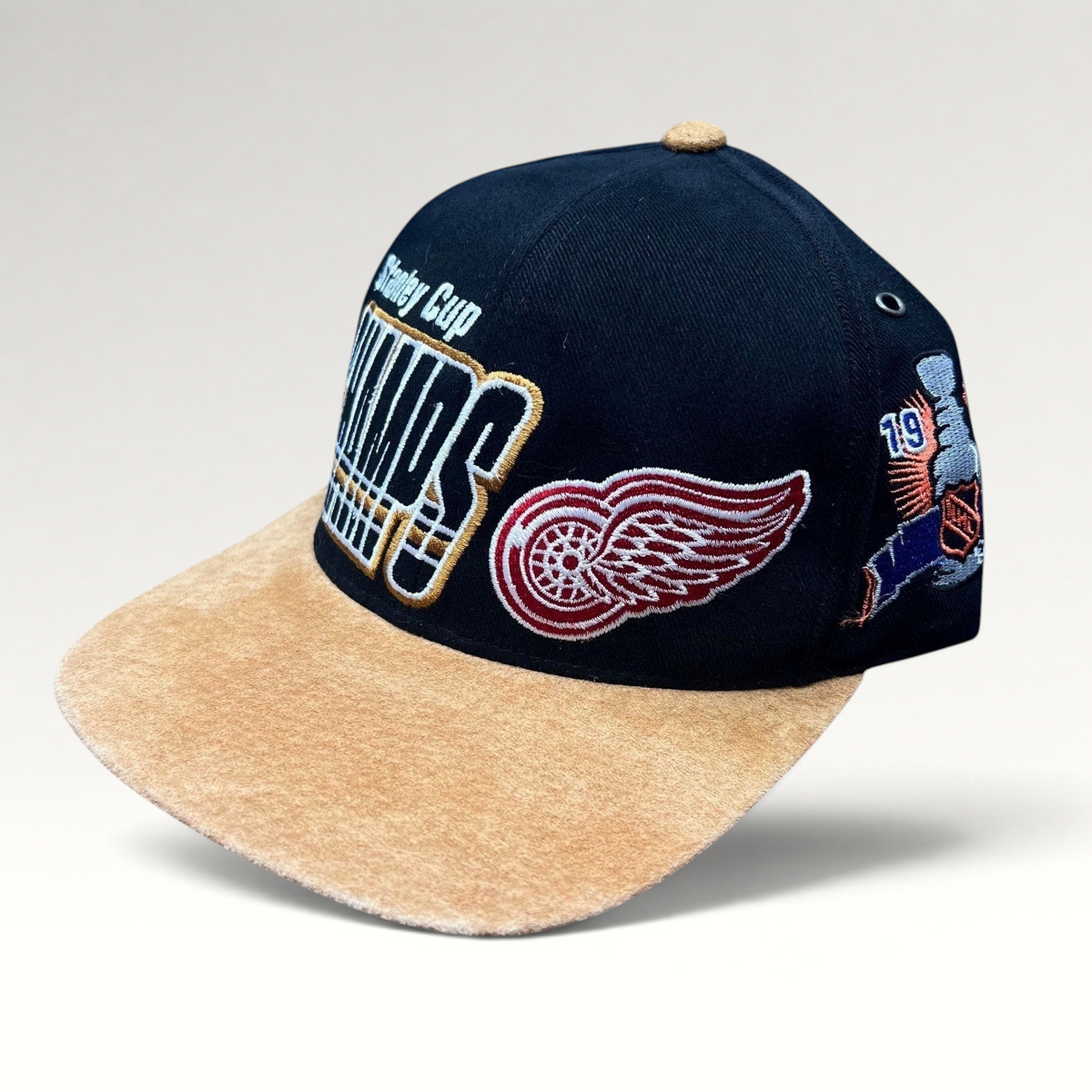 Raree Finds vintage Detroit Red Wings 1997 Stanley Cup Champs Starter snapback hat with black crown and tan suede brim.