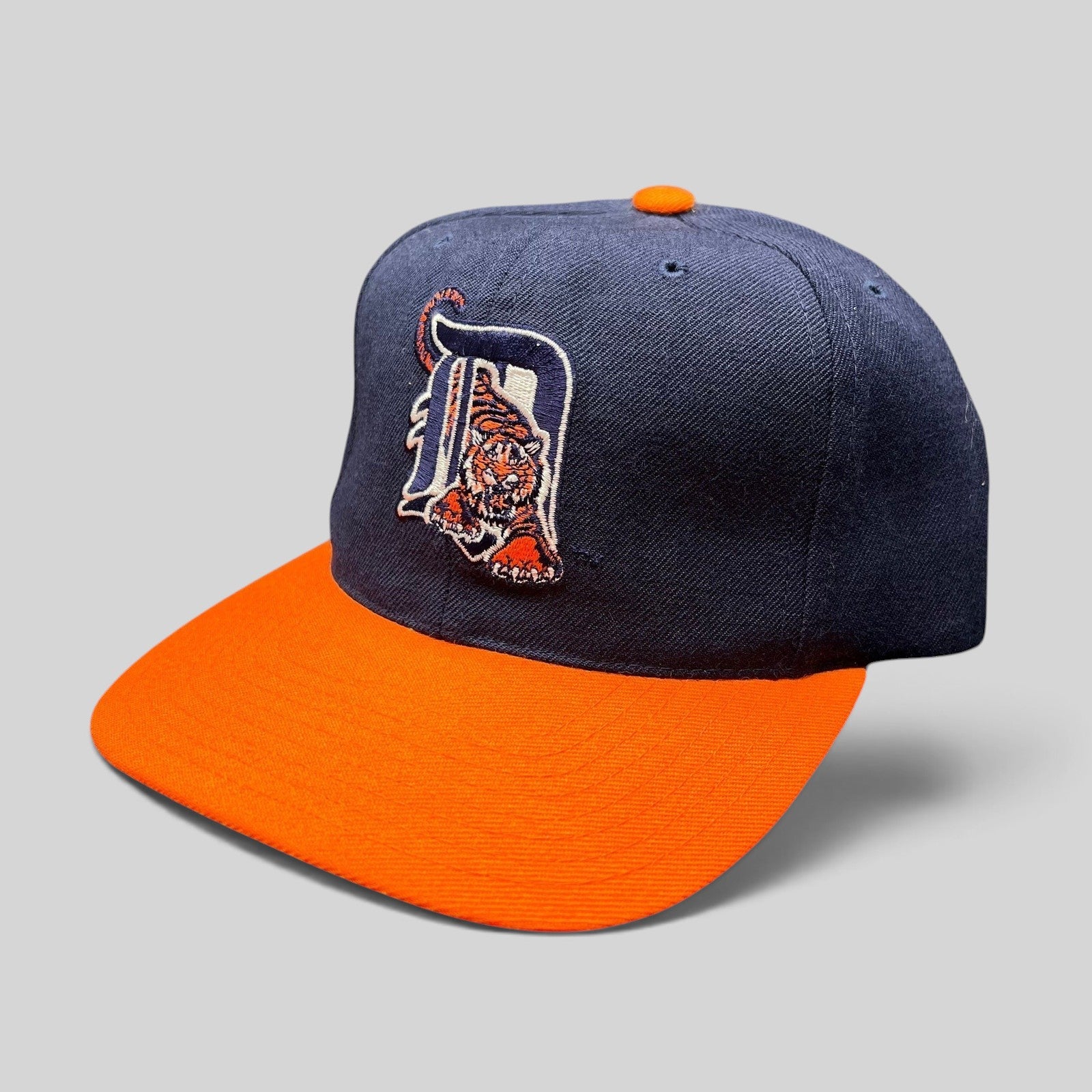 Raree Finds vintage American Needle Detroit Tigers wool snapback hat with navy crown, orange brim, and tiger logo.