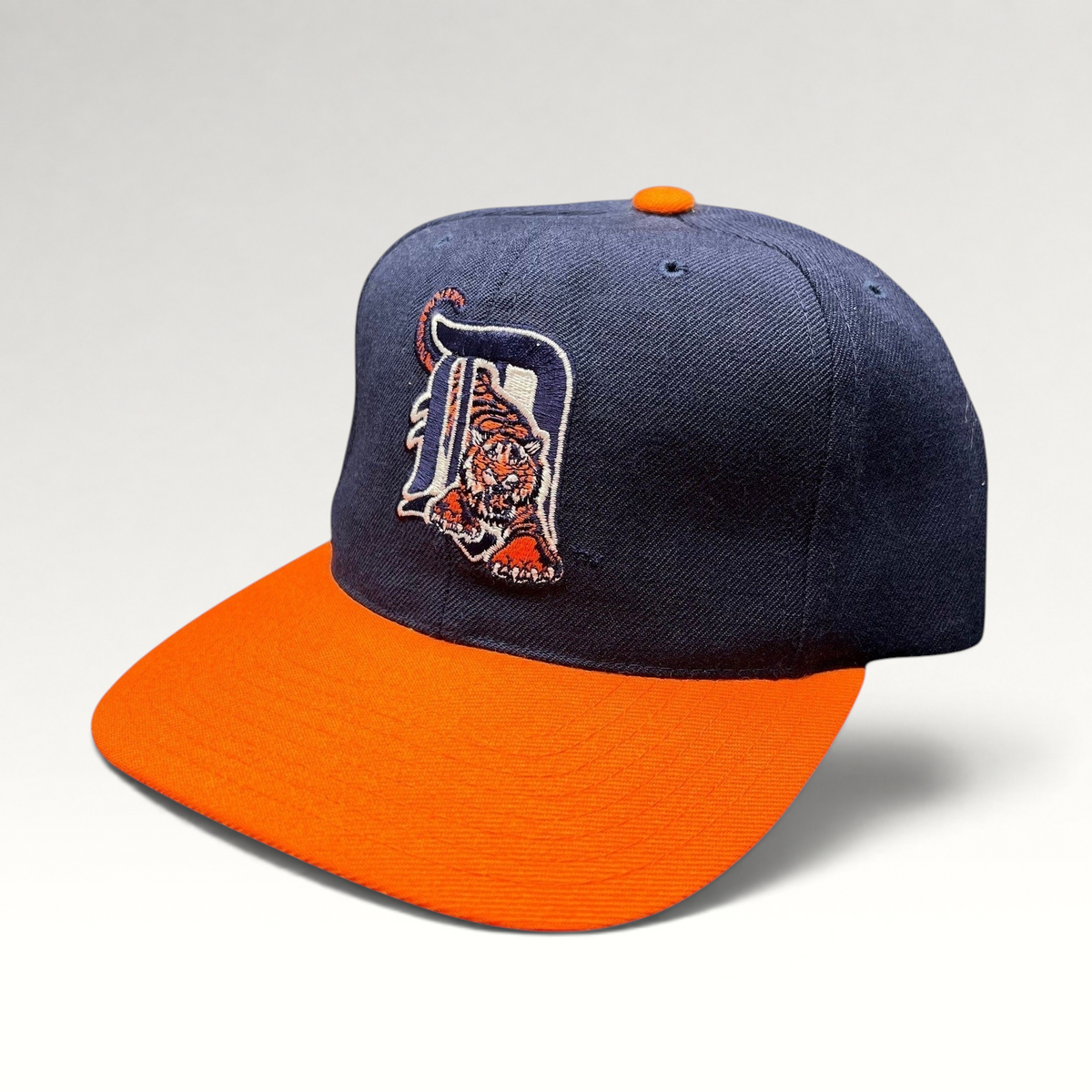 Raree Finds vintage American Needle Detroit Tigers wool snapback hat with navy crown, orange brim, and tiger logo.